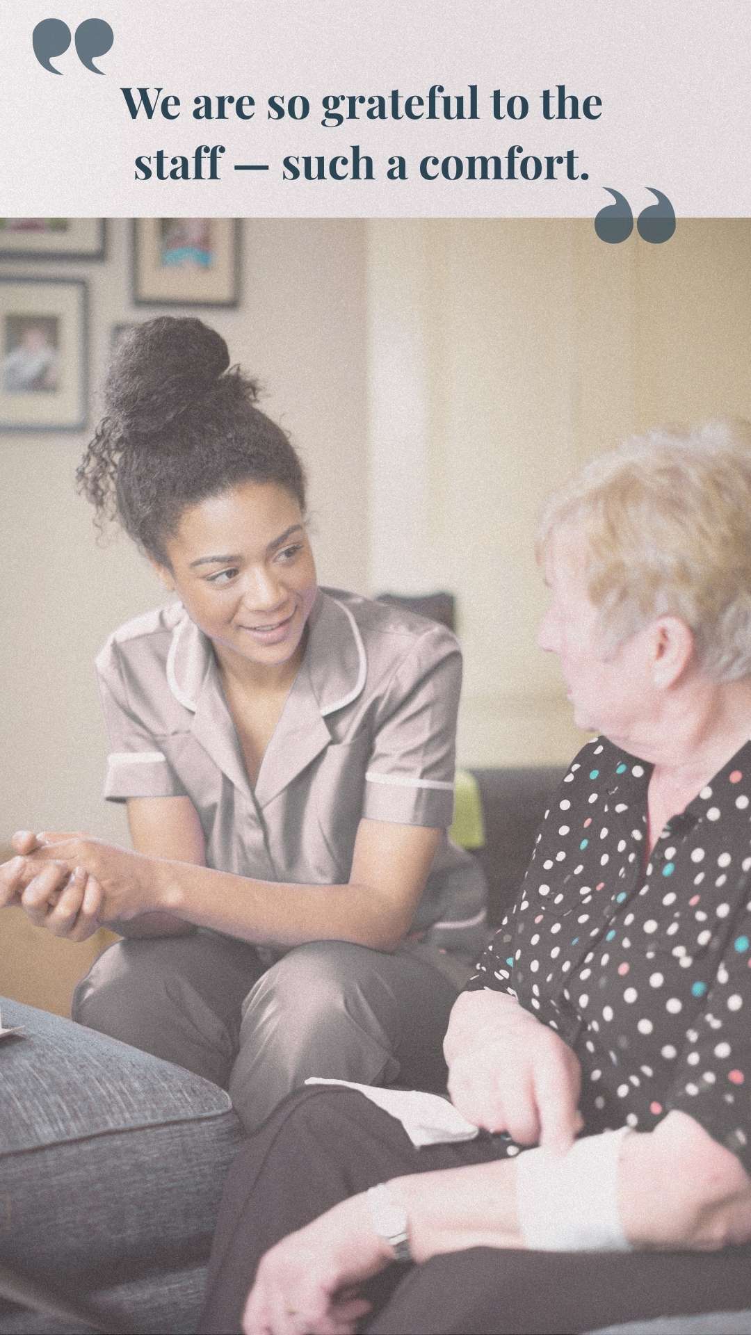 Caregiver sitting and talking with an elderly person in a homely setting.
