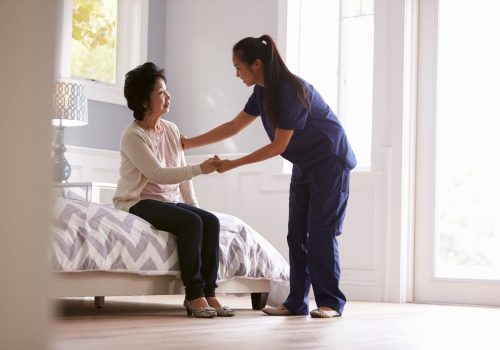 Nurse Making Home Visit To Senior Woman Nurse Making Home Visit To Senior Woman